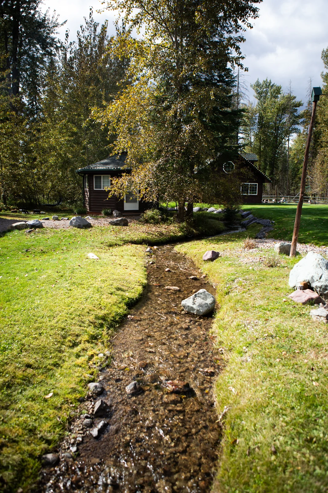 Garnier Creek winding between Blue Star's wooded lodging areas