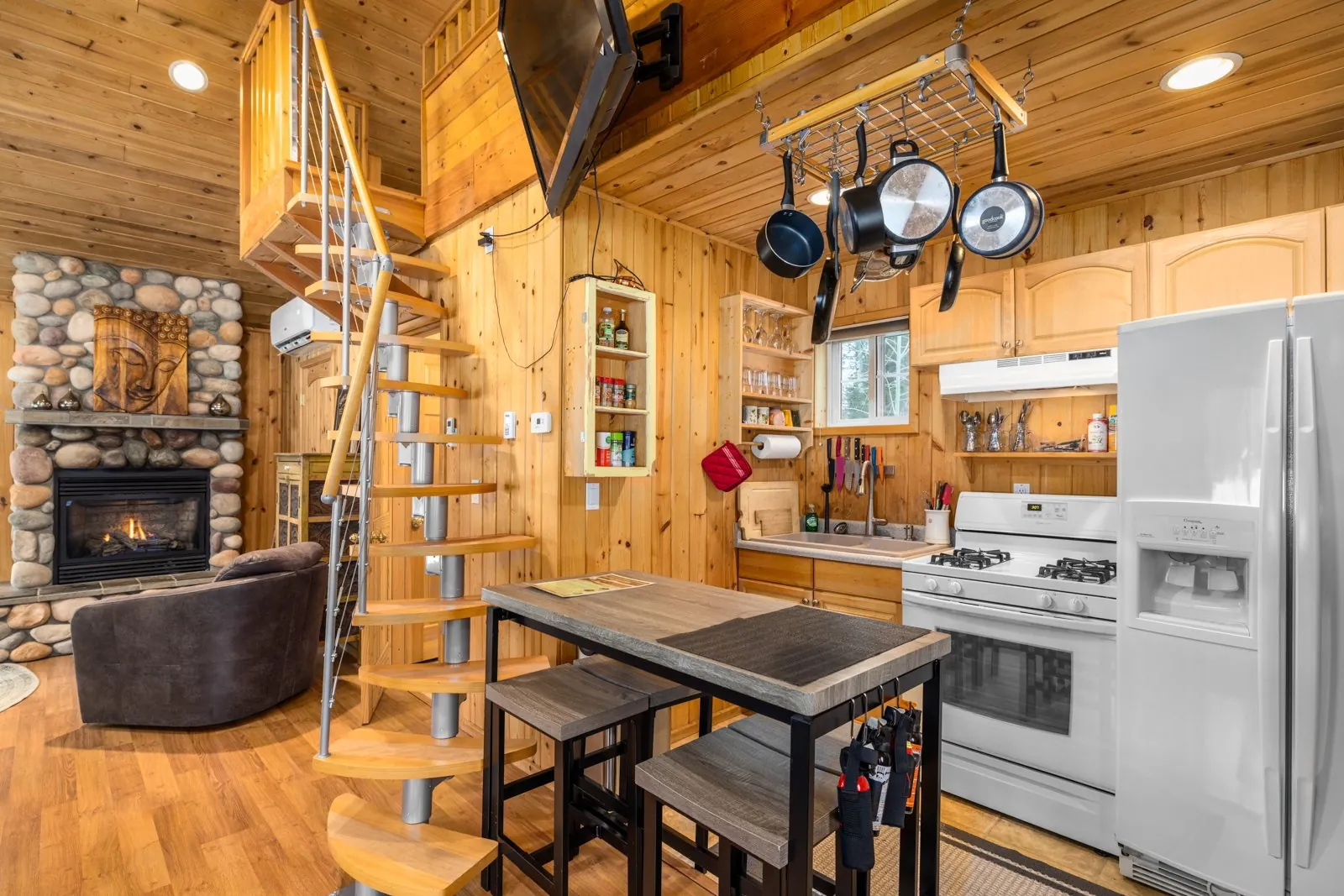 Cabin kitchenette and dining area beside the staircase
