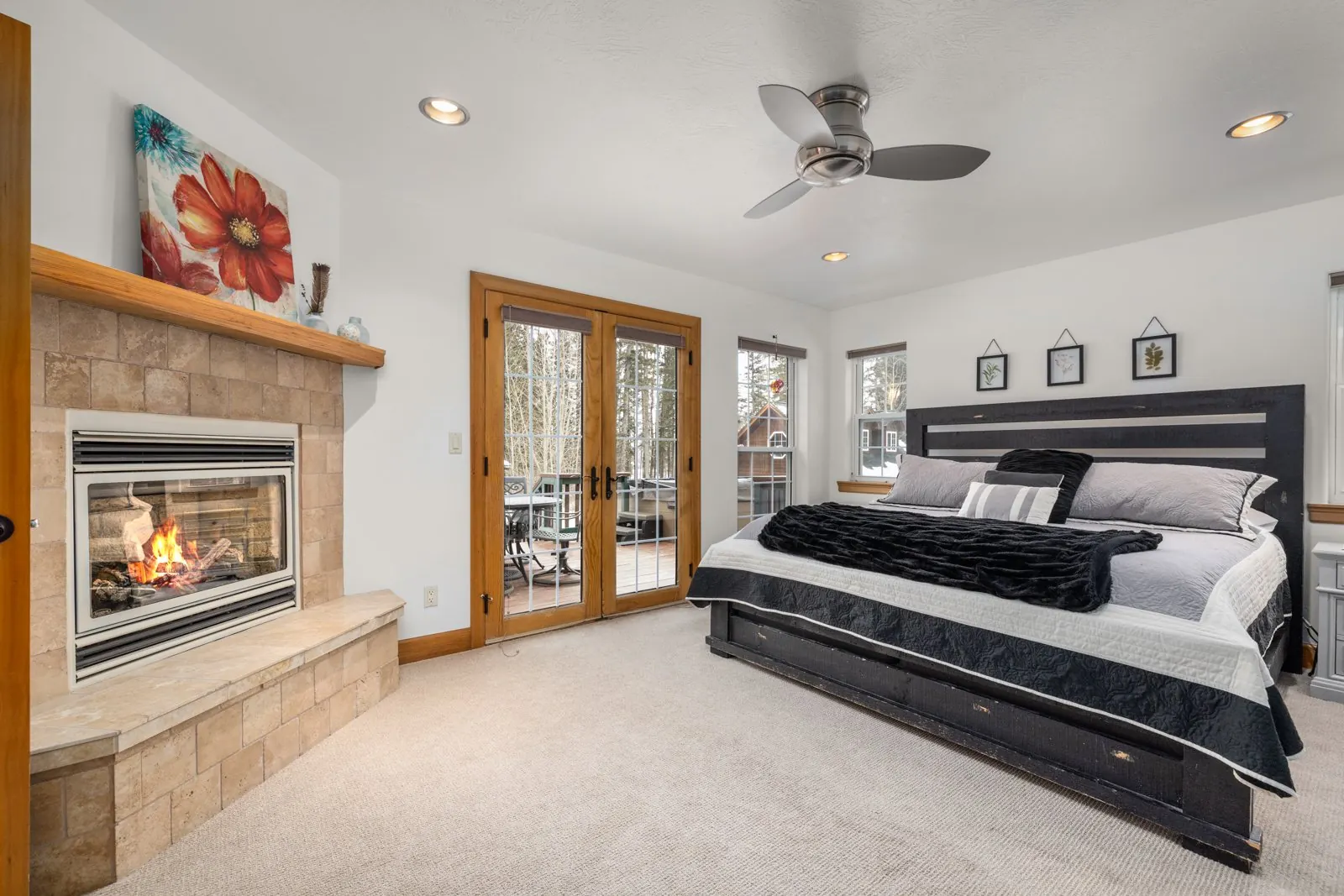 Bedroom in the Main Lodge with fireplace and exterior doors