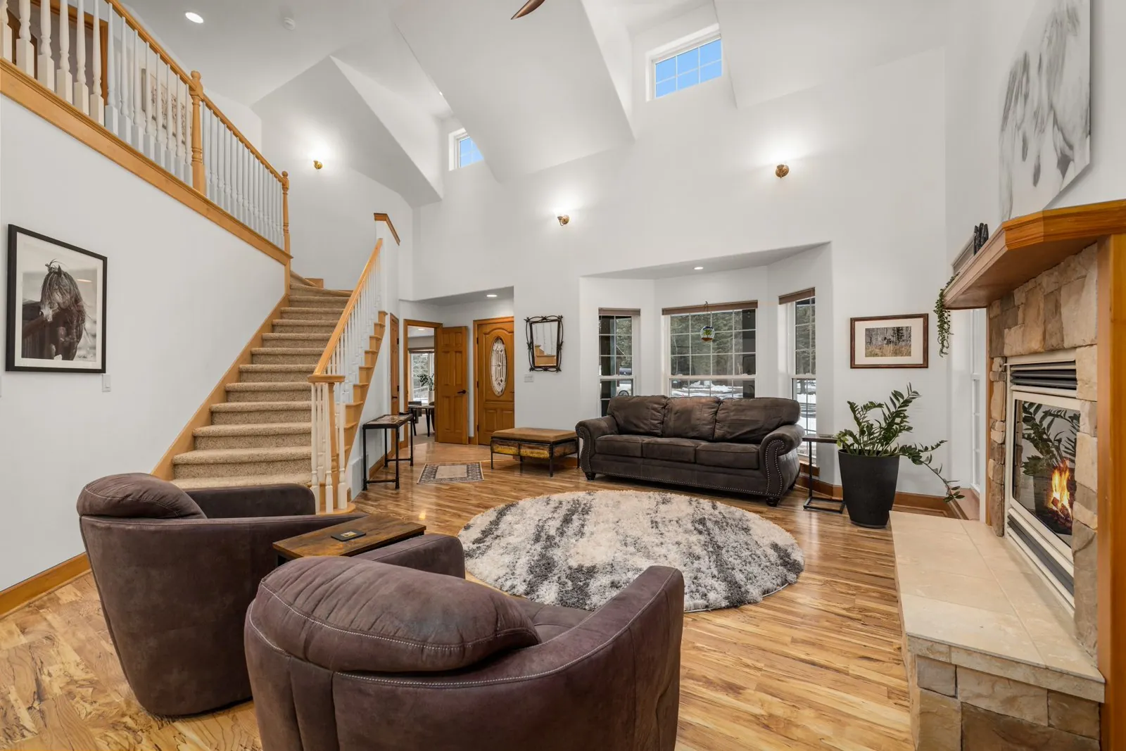Main Lodge living room with timber staircase