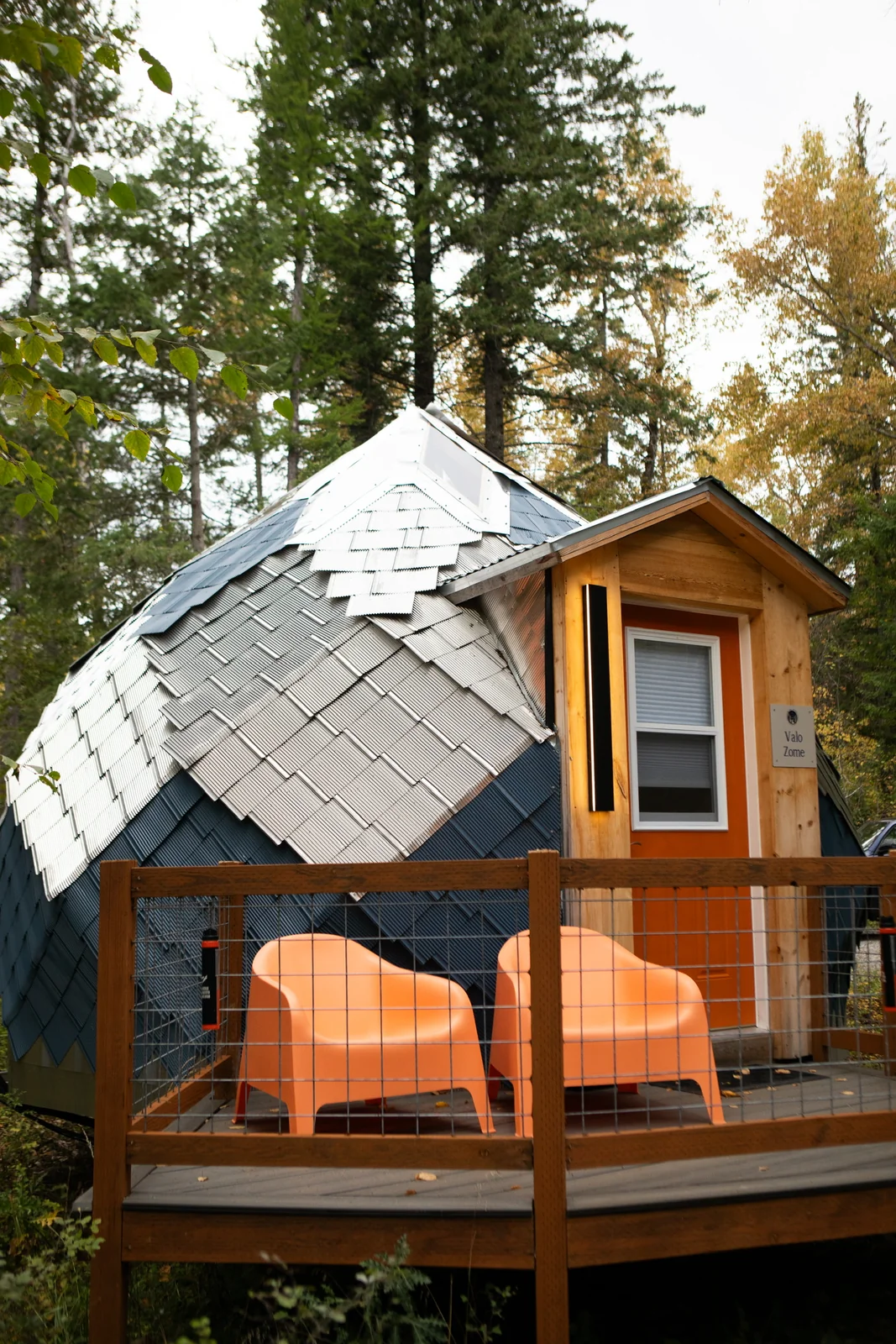 Blue Star zome with a private deck and orange chairs